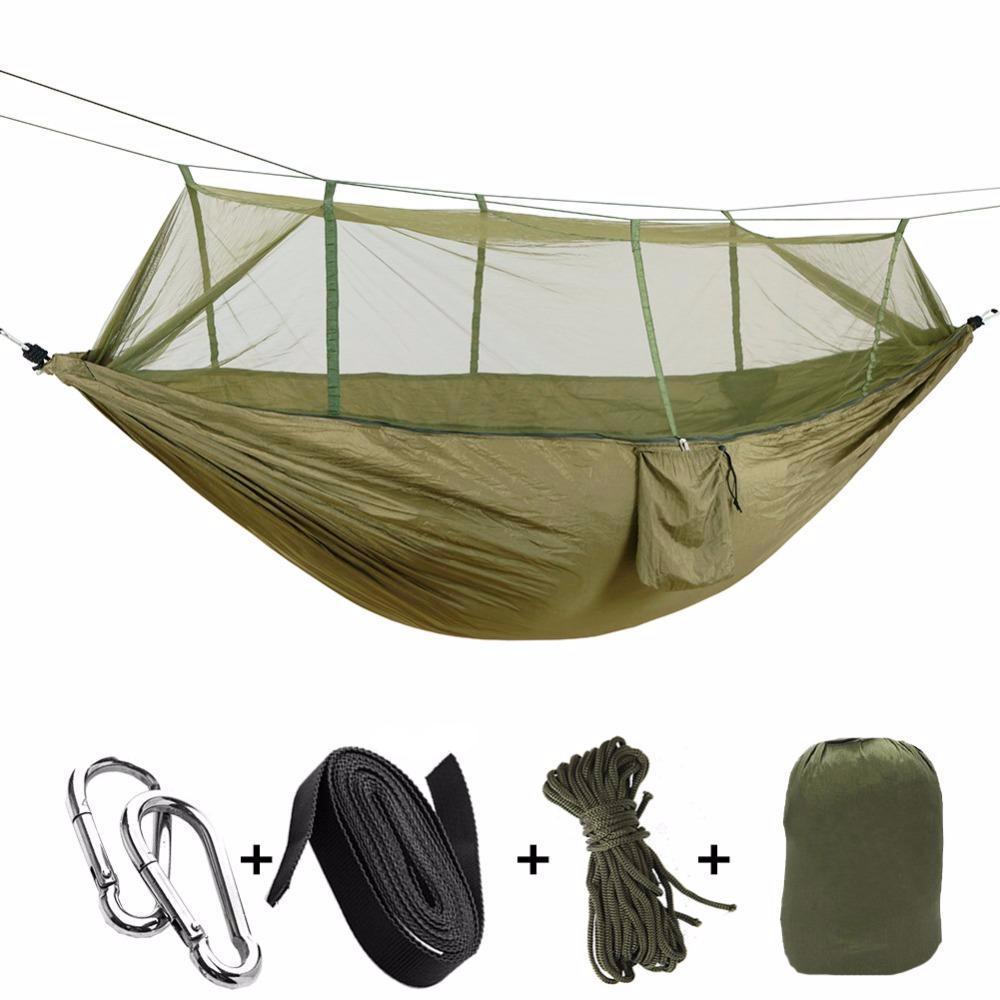 Camping hammock with built-in mosquito net, showcasing its spacious design and durable parachute nylon fabric.