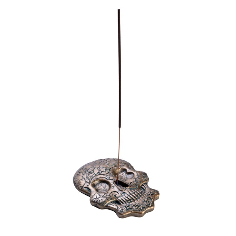 A beautifully designed Candy Skull Incense Burner featuring a gold skull, perfect for burning incense sticks.