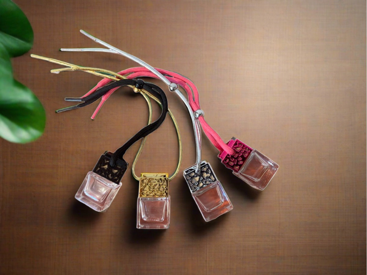 Car fragrance air freshener in a stylish bottle, designed to hang in the car interior, offering a variety of scents.