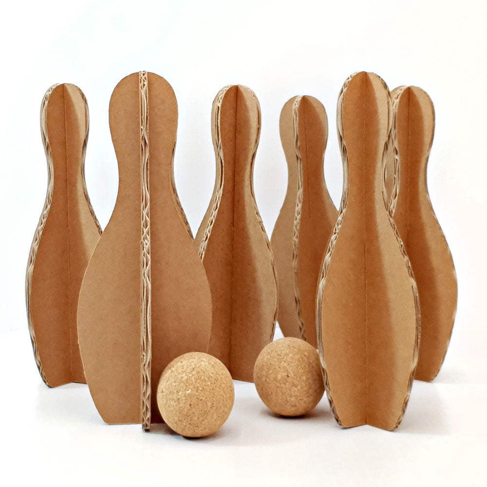 ECO Cardboard Bowling Set featuring beige cardboard pins and cork balls, perfect for family fun and safe play.