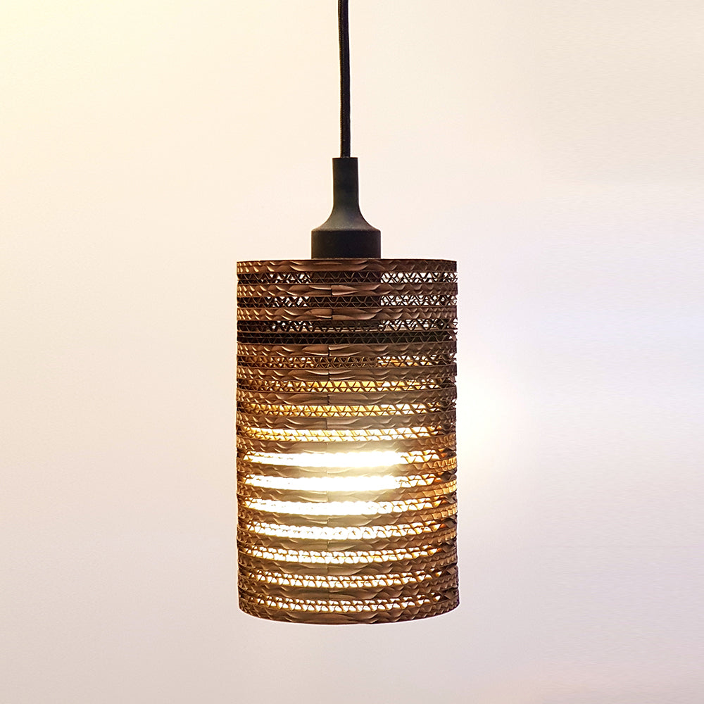 Cardboard Ceiling Lamp SMALL featuring a cylindrical design made from eco-friendly corrugated cardboard, showcasing its unique texture and E27 bulb fitting.