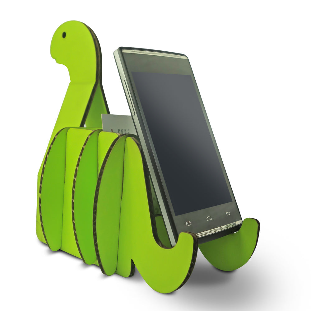 Colorful cardboard table organiser shaped like a dinosaur, designed for kids to hold pencils, business cards, and phones.