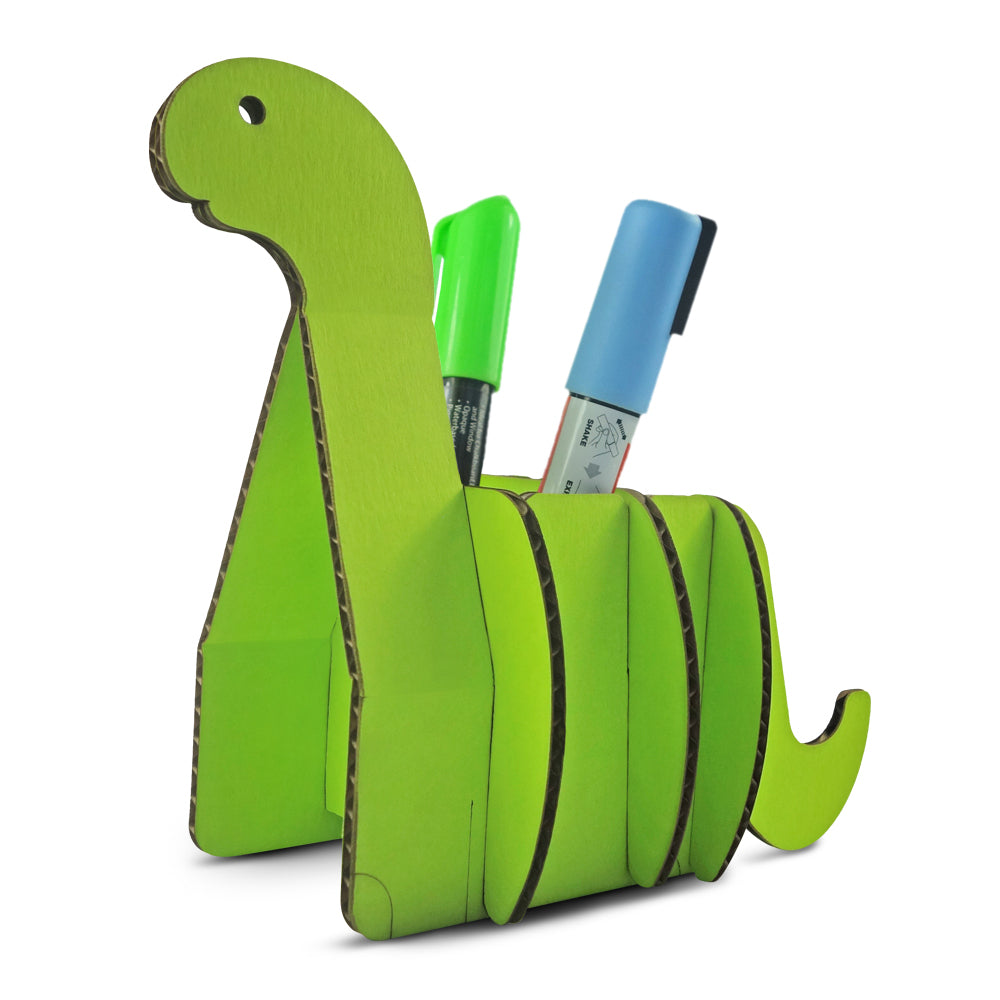 Colorful cardboard table organiser shaped like a dinosaur, designed for kids to hold pencils, business cards, and phones.