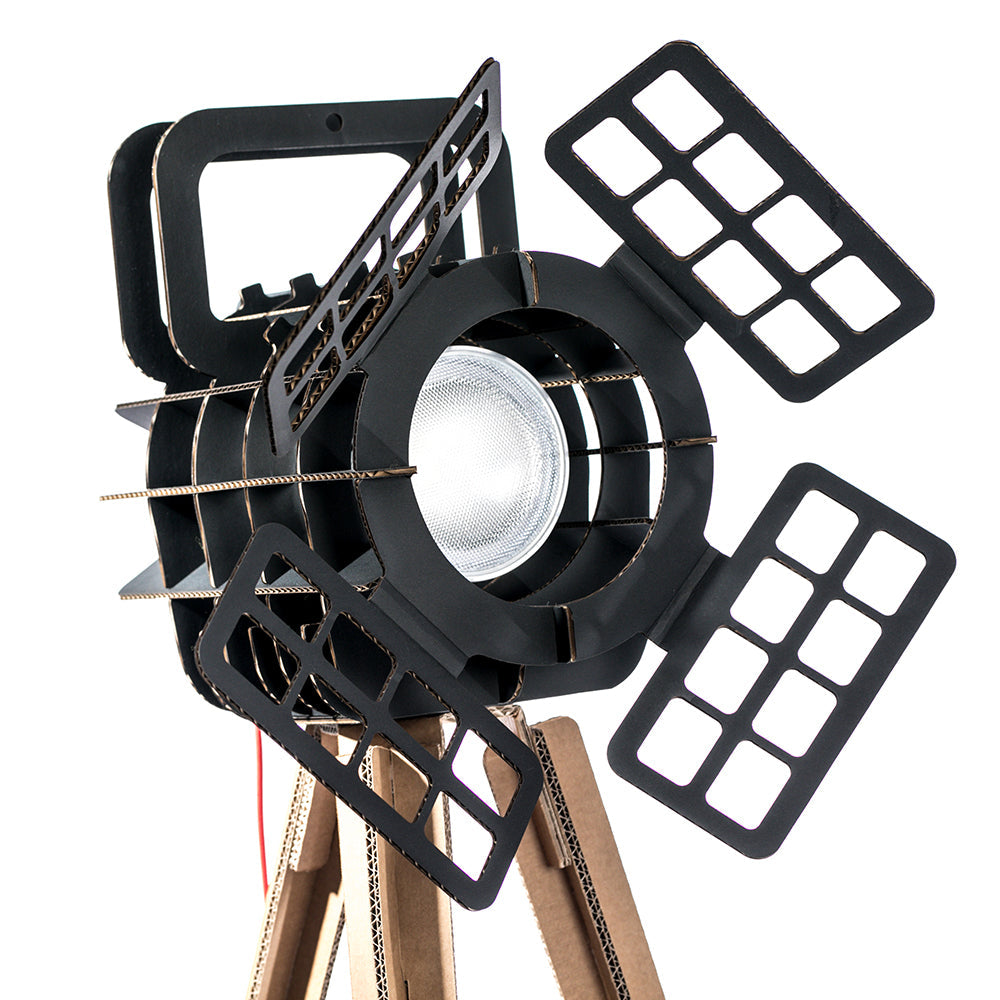 Cardboard Tripod Projector SHOW featuring a stylish design with a spotlight illuminating an object, made from colored corrugated cardboard.