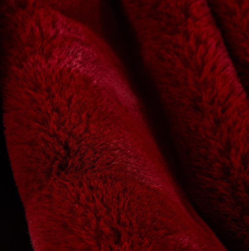 Cassilda Luxury Red Chinchilla Faux Fur Throw Blanket showcasing its plush texture and vibrant red color, perfect for home decor.