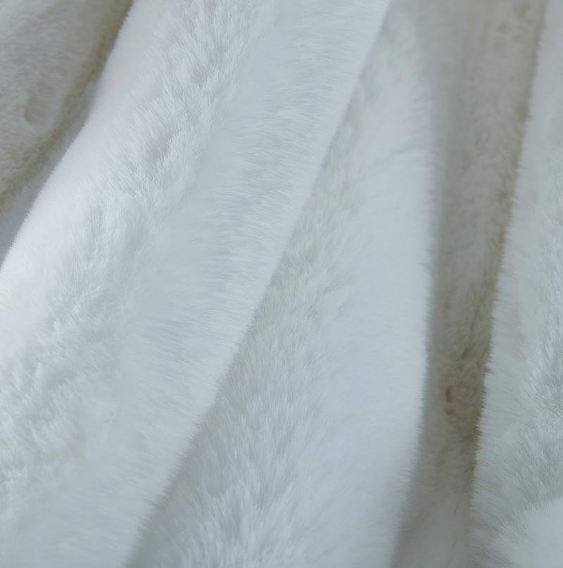 Cassilda Luxury White Chinchilla Faux Fur Throw Blanket showcasing plush texture and elegant design.