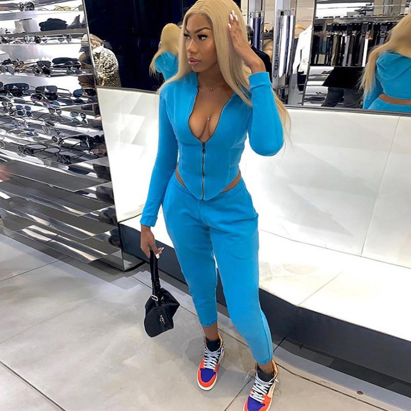 Casual Workout Sporty Two Piece Set for Women featuring a hooded long sleeve top and ankle-length pants in green, blue, and grey colors.