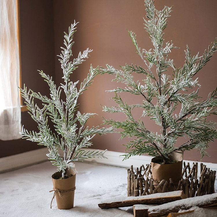 Cedar Fir Tree Snow Flocked Christmas Tree with a paper wrapped base, showcasing realistic snow and green foliage.