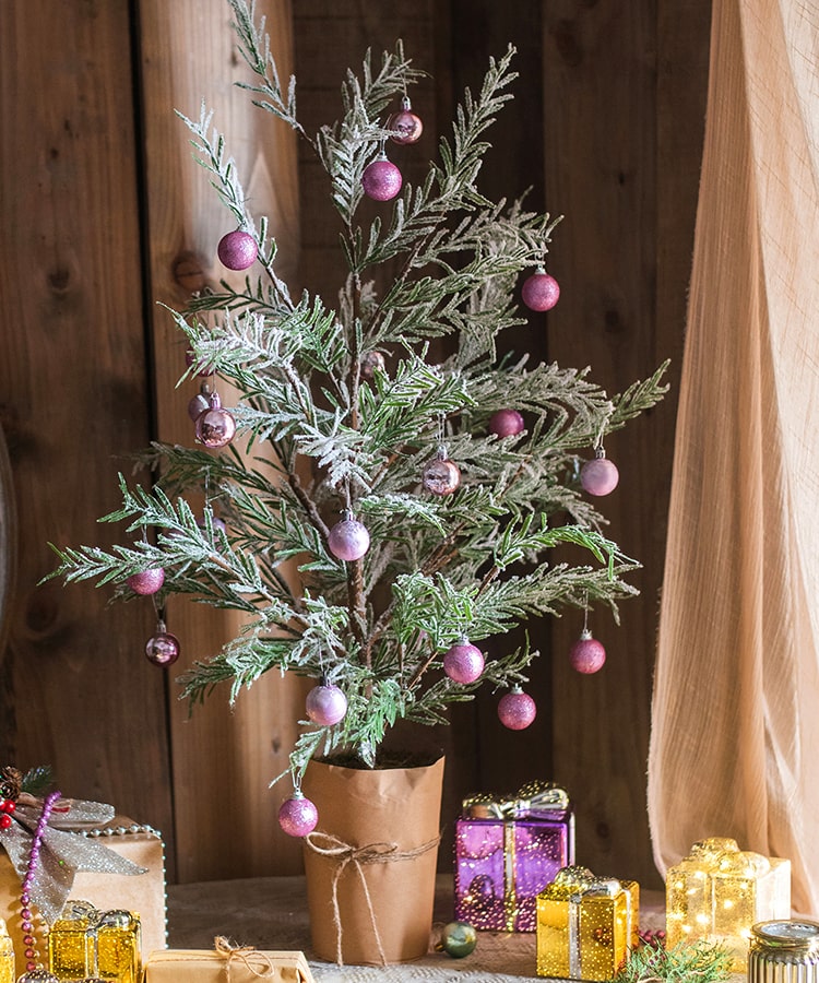 Cedar Fir Tree Snow Flocked Christmas Tree with a paper wrapped base, showcasing realistic snow and green foliage.