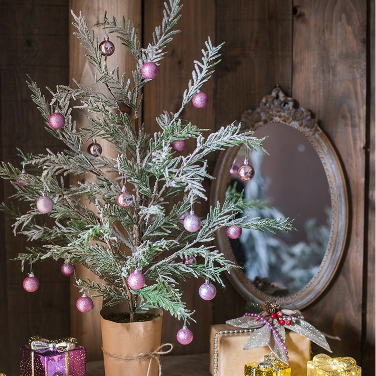 Cedar Fir Tree Snow Flocked Christmas Tree with a paper wrapped base, showcasing realistic snow and green foliage.