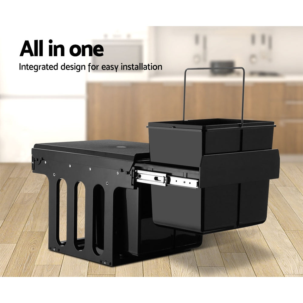 Cefito 2x15L Pull Out Bin in black, featuring dual compartments with lids for waste separation, mounted inside a kitchen cabinet.