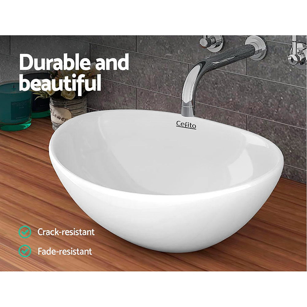 Cefito Ceramic Oval Sink Bowl in White, showcasing its elegant design and high gloss finish.