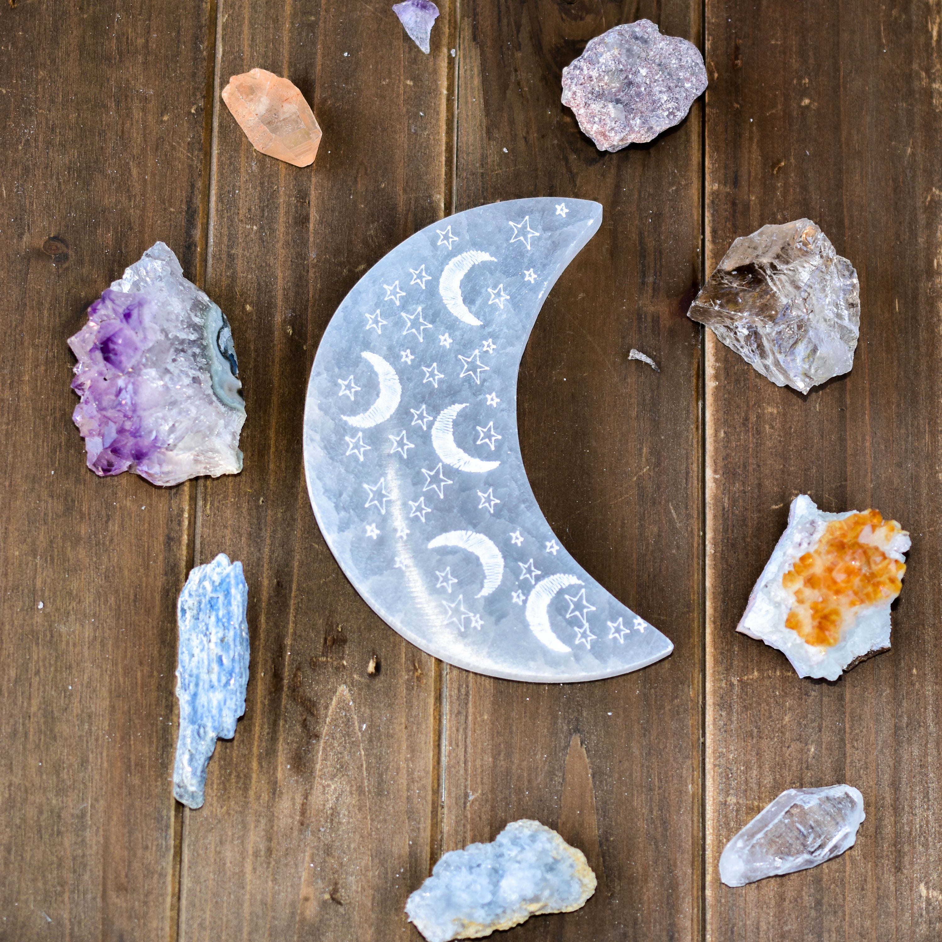 Celestial Engraved Crescent Moon Selenite Plate with intricate moon and star designs, perfect for crystal charging and jewelry display.