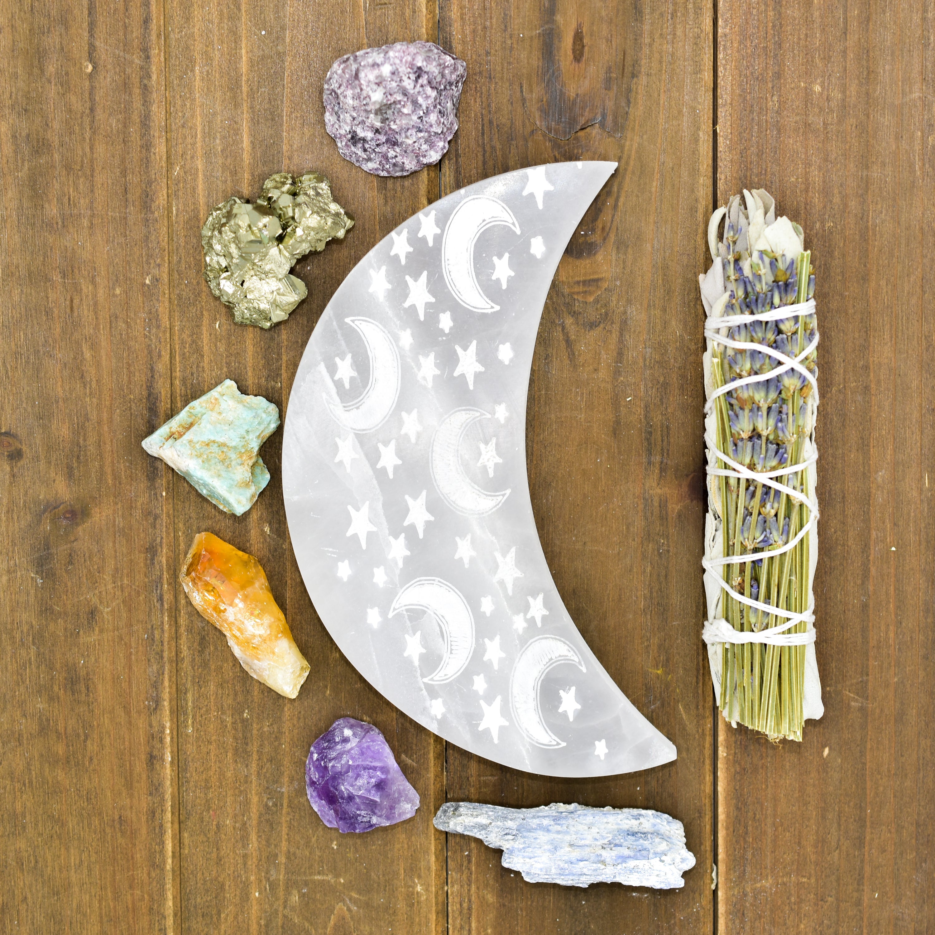 Celestial Engraved Crescent Moon Selenite Plate with intricate moon and star designs, perfect for crystal charging and jewelry display.