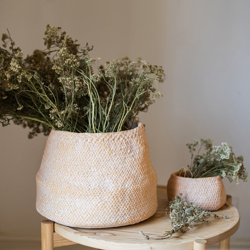 Cement Weaving Pattern Planter in khaki color, showcasing its unique design and drainage hole.