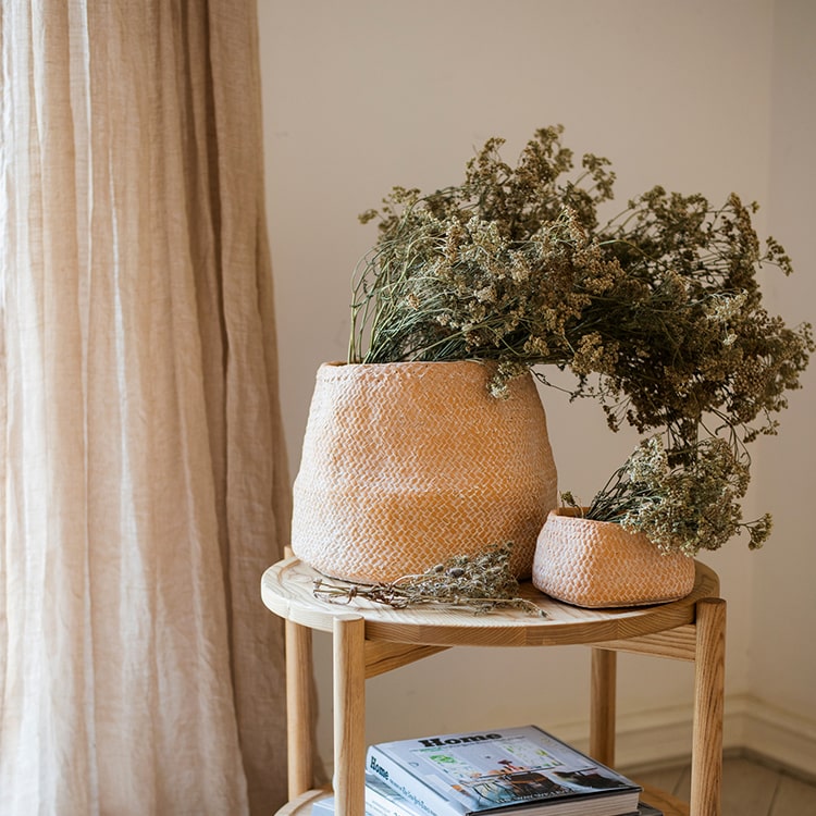 Cement Weaving Pattern Planter in khaki color, showcasing its unique design and drainage hole.