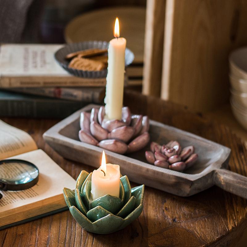 Handmade ceramic floral candle holder in light blue, blue, green, and red colors, showcasing unique designs and dimensions.