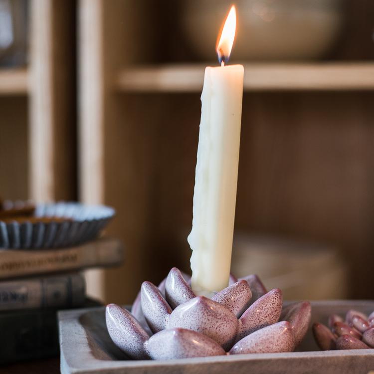 Handmade ceramic floral candle holder in light blue, blue, green, and red colors, showcasing unique designs and dimensions.