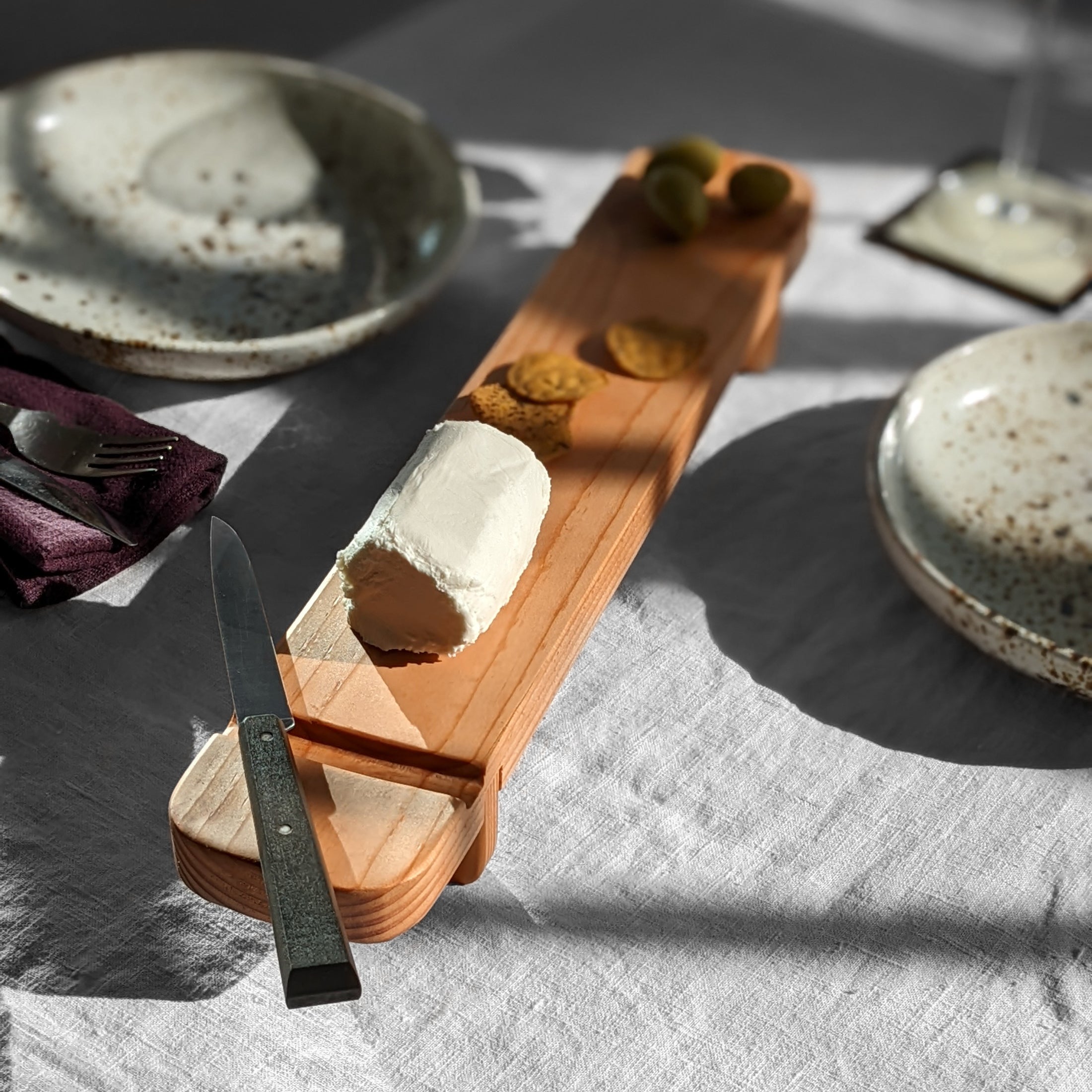 Handcrafted Charcuterie Board made from Doug Fir with a beeswax finish and a knife groove, measuring 18" x 3.25" x 2.25".