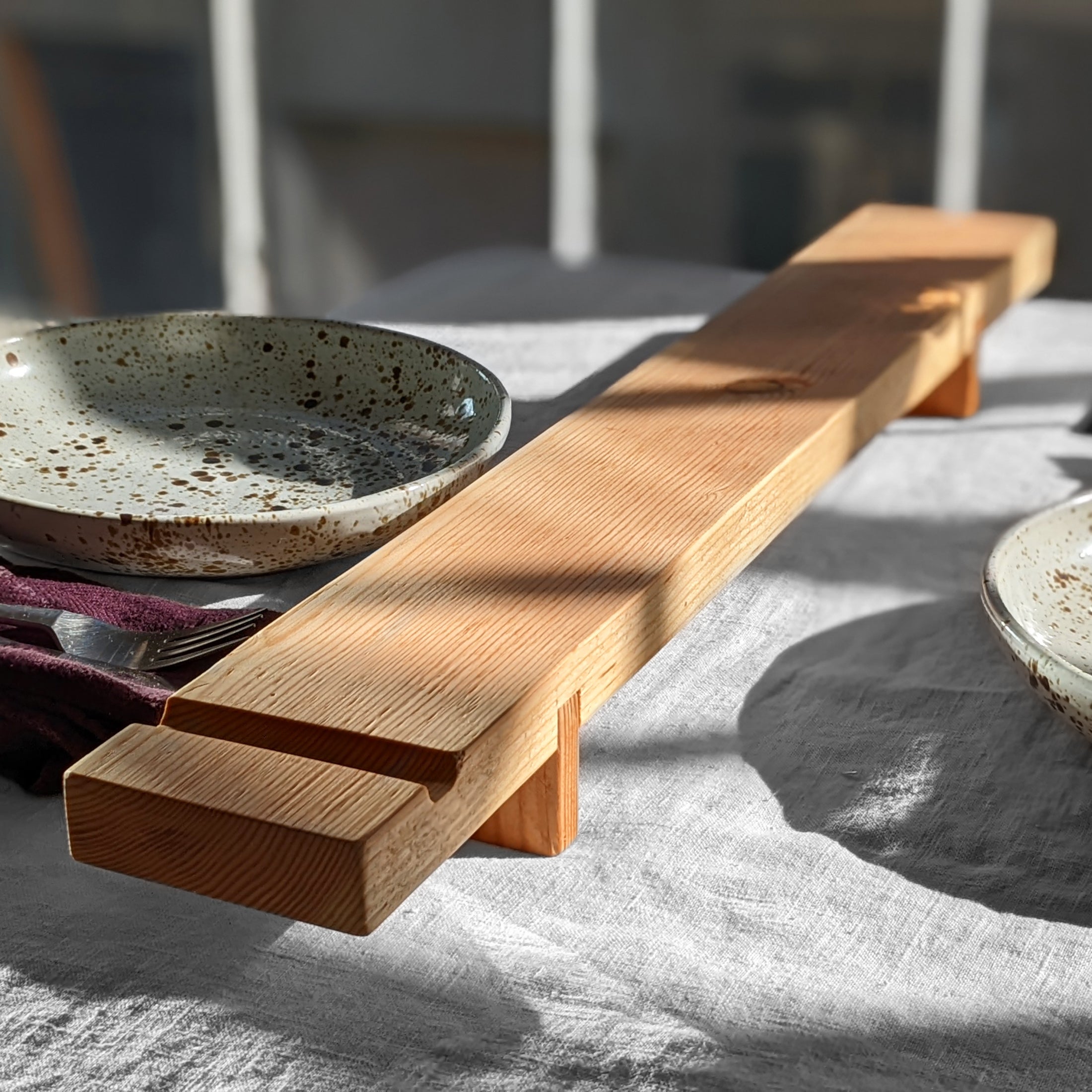 Charcuterie Board 2 made from Doug Fir with a beeswax finish, featuring a sleek design and knife groove for serving appetizers.