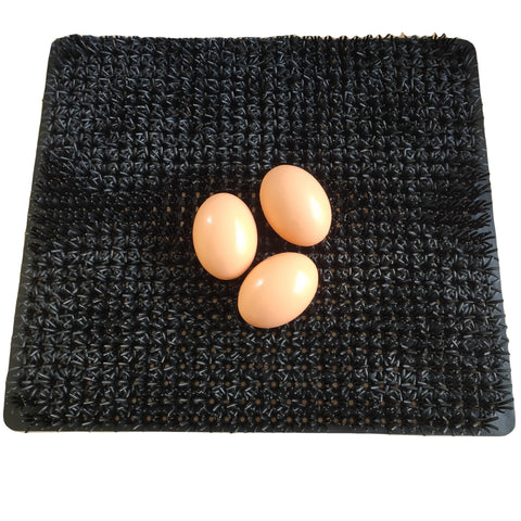 Cheeky Chooka Nesting Box Egg Mat in black, featuring a cushioned surface and slotted base for air circulation.