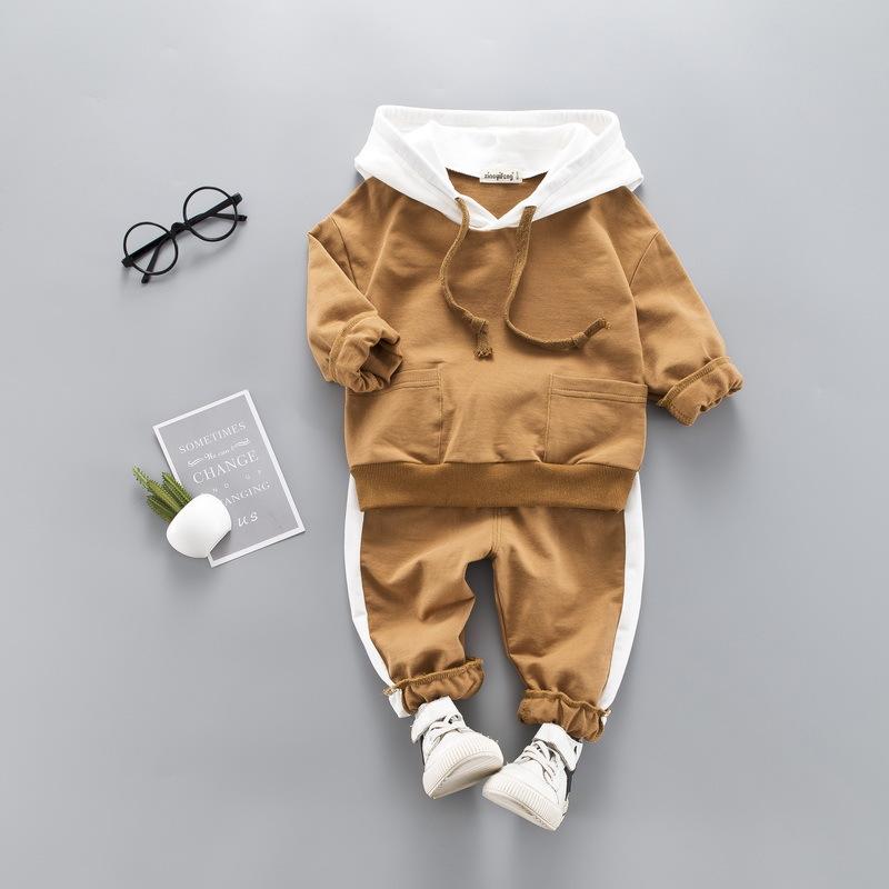 A stylish toddler girls' clothing set featuring a hooded top and pants, made from 100% cotton, perfect for spring and autumn wear.