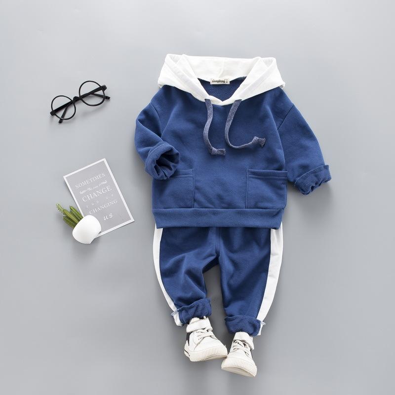 A stylish toddler girls' clothing set featuring a hooded top and pants, made from 100% cotton, perfect for spring and autumn wear.