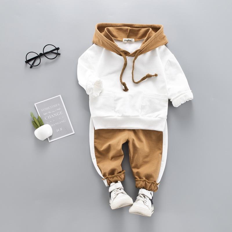 A stylish toddler girls' clothing set featuring a hooded top and pants, made from 100% cotton, perfect for spring and autumn wear.