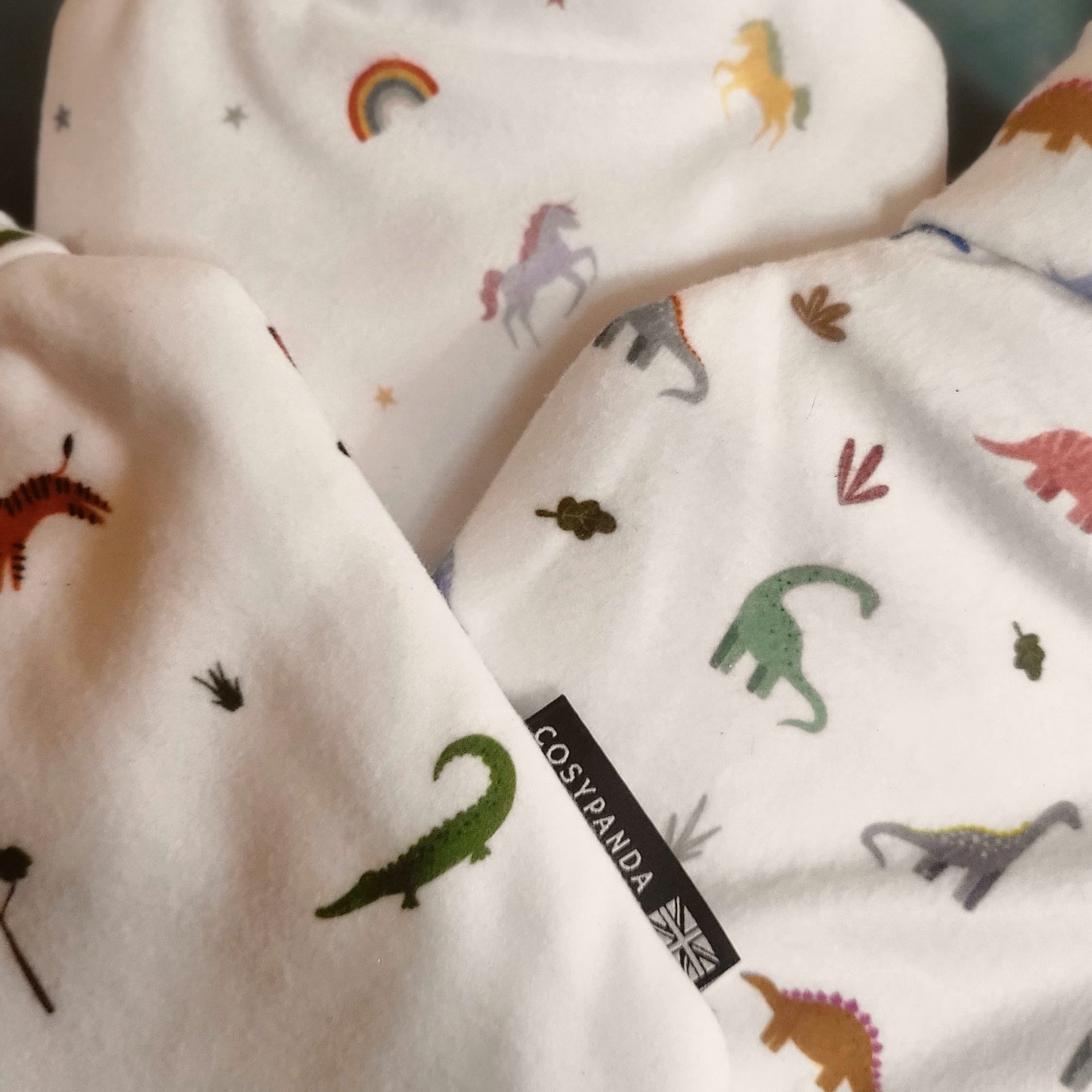 Children’s Safari Print 1L Hot Water Bottle with a soft cover featuring playful safari animals, designed for comfort and warmth.