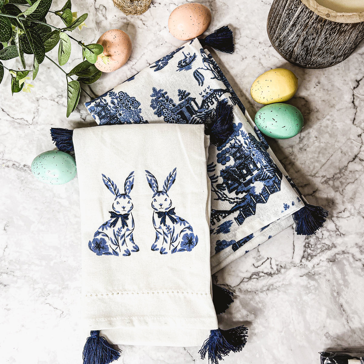 Chinoiserie Bunny dish towels featuring a blue and white design with decorative tassels, perfect for spring and Easter decor.