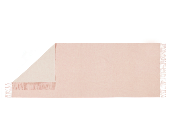 Chiswick Scarf in blush color, made from cashmere and merino wool blend, elegantly draped on a soft surface.