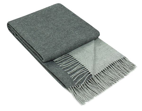 Chiswick Throw blanket made from Merino wool and cashmere in charcoal color, showcasing its luxurious texture and elegant design.