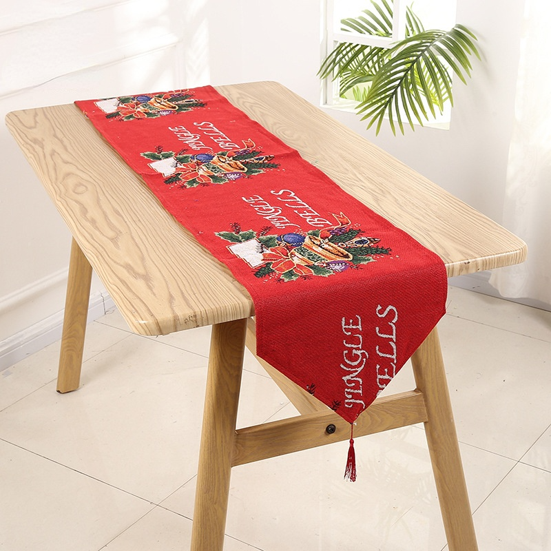 Christmas bell pattern table runner made of high-quality linen, featuring elegant design and hemmed edges for a festive table setting.