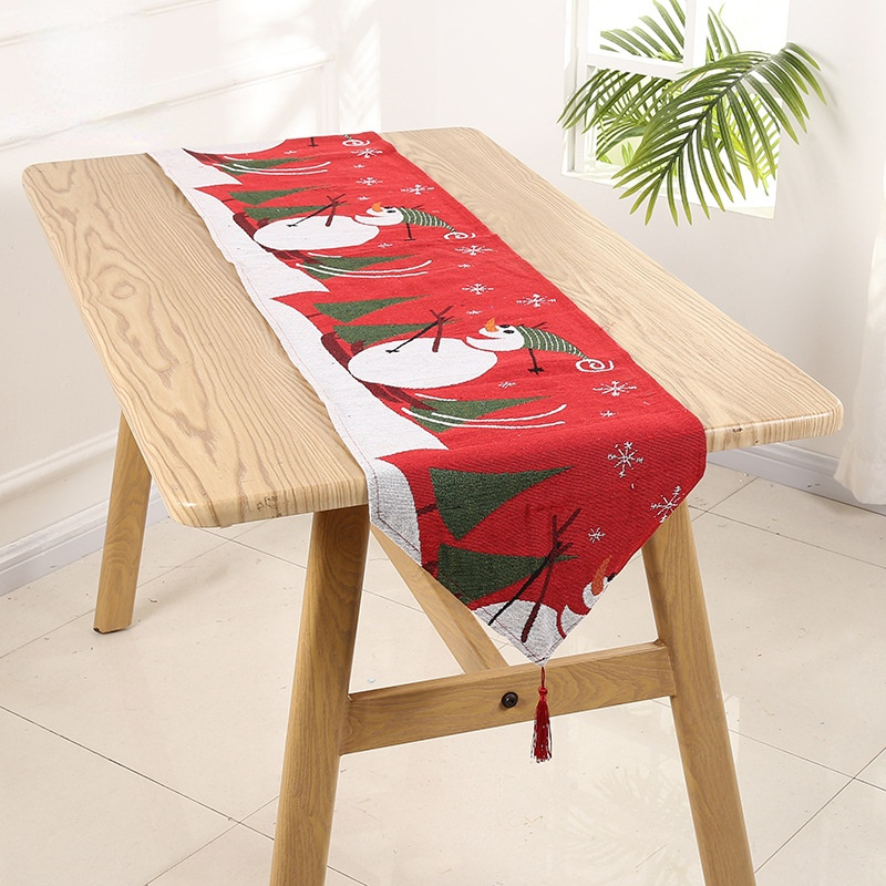 Christmas bell pattern table runner made of high-quality linen, featuring elegant design and hemmed edges for a festive table setting.