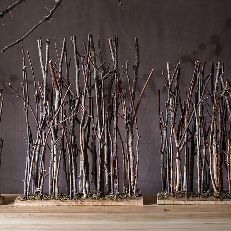 Christmas Branch Fence Decoration made from natural hazelnut wood and green moss, showcasing a rustic and festive design.