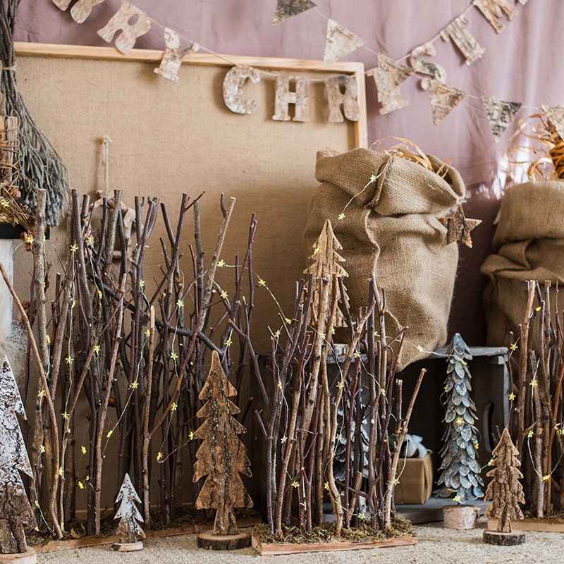 Christmas Branch Fence Decoration made from natural hazelnut wood and green moss, showcasing a rustic and festive design.