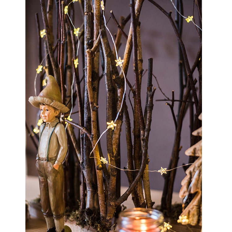 Christmas Branch Fence Decoration made from natural hazelnut wood and green moss, showcasing a rustic and festive design.