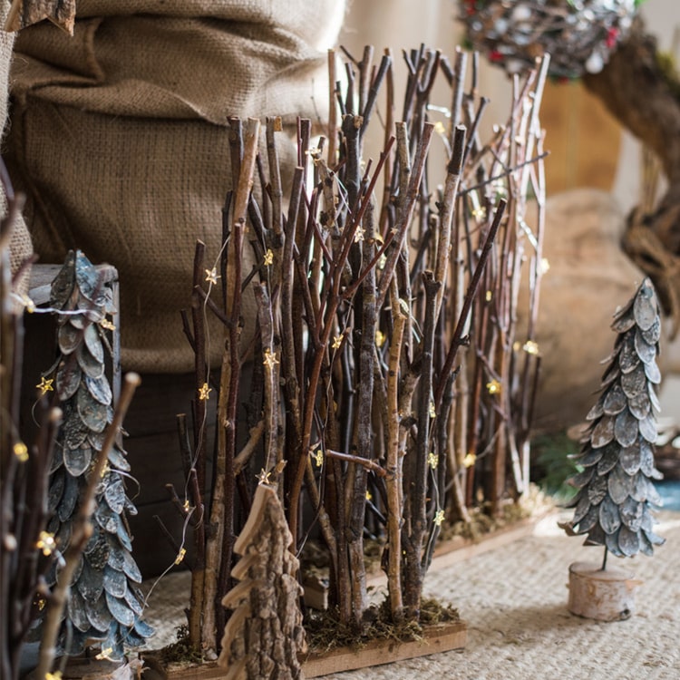 Christmas Branch Fence Decoration made from natural hazelnut wood and green moss, showcasing a rustic and festive design.