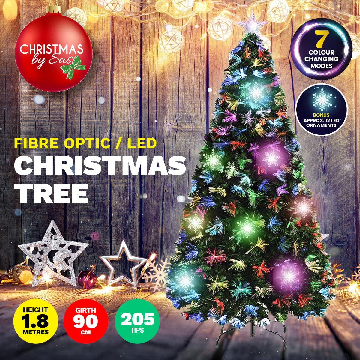 A beautifully lit 1.8m fibre optic Christmas tree with 210 tips, featuring a colour-changing star and snowflake ornaments, displayed in a festive setting.