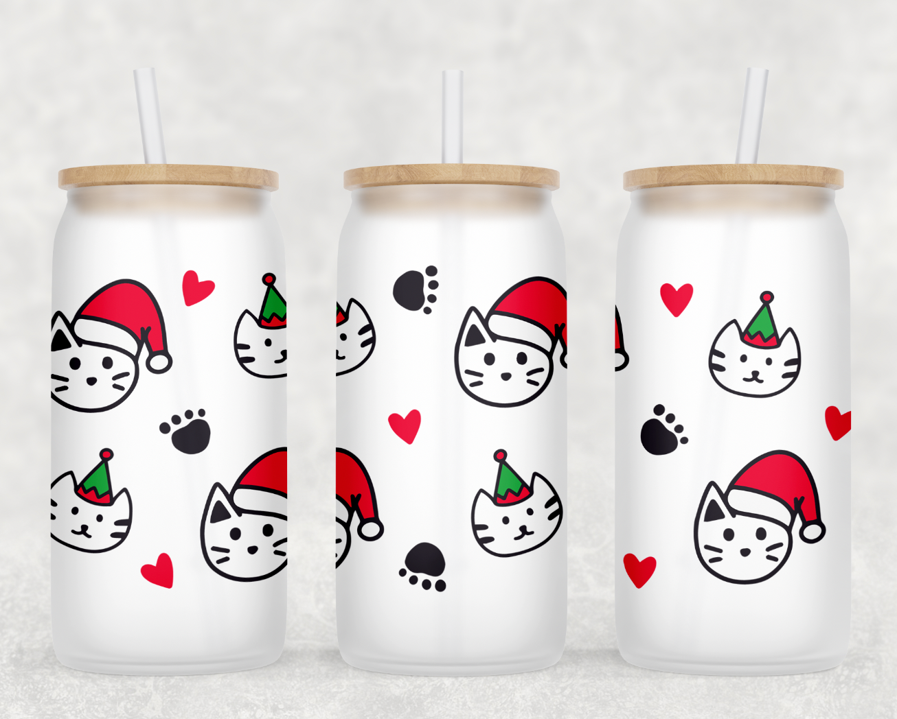 A festive Christmas Cats Glass Can Tumbler with a bamboo lid and clear plastic straw, showcasing adorable cat designs on frosted glass.