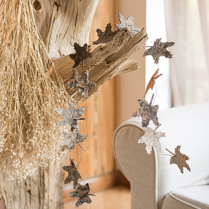 Christmas Decorative String featuring various shapes like maple leaves and pine cones, perfect for festive holiday decor.