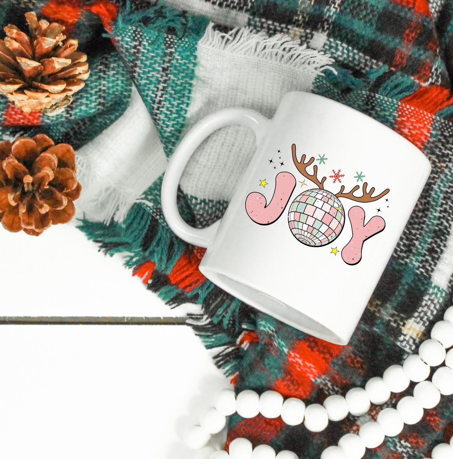 A glossy white ceramic mug with a festive Christmas design, perfect for coffee or tea.