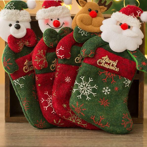 A collection of festive Christmas ornaments and socks in army green, perfect for holiday decorations.