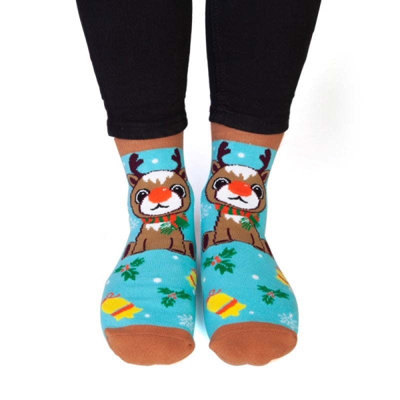 Cozy Christmas socks featuring a red-nosed reindeer with a stripy scarf and festive snowflakes.