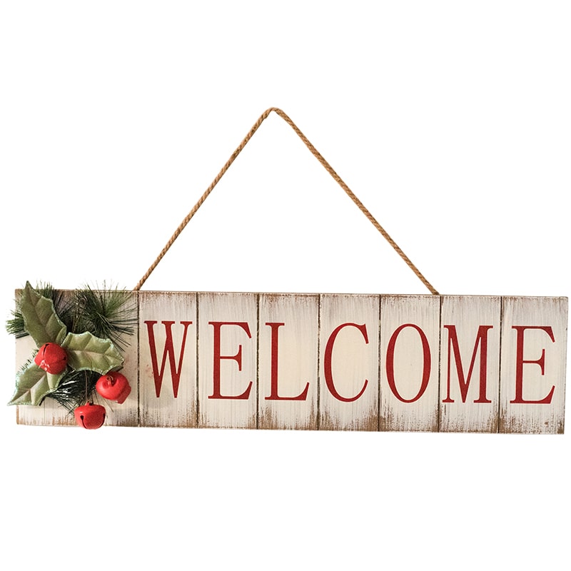 A festive Christmas Welcome Sign made of wood, featuring vibrant red, white, and green colors, adorned with faux plants and a hemp rope for hanging.