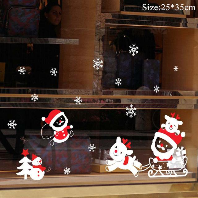 Colorful Christmas window stickers featuring Santa, snowflakes, and festive designs for holiday decoration.