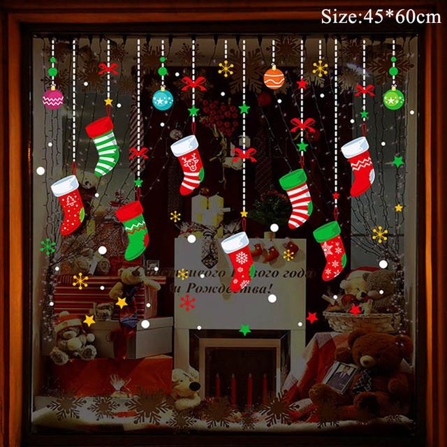 Colorful Christmas window stickers featuring Santa, snowflakes, and festive designs for holiday decoration.