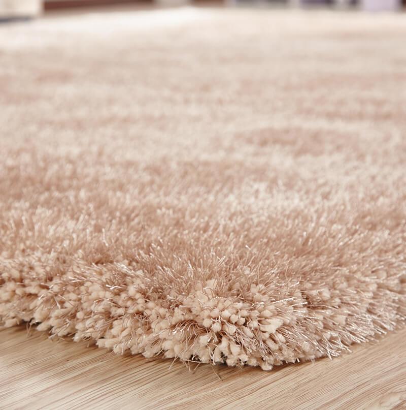 Chubby Beige Area Rug showcasing soft shaggy texture and solid color design, perfect for home decor.