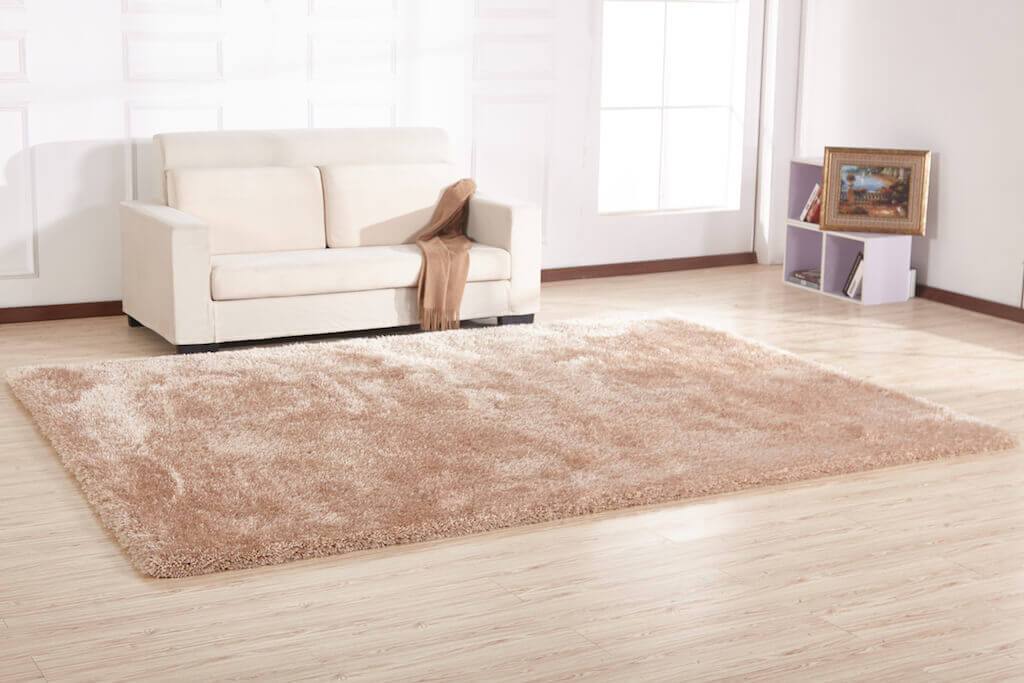 Chubby Beige Area Rug showcasing soft shaggy texture and solid color design, perfect for home decor.