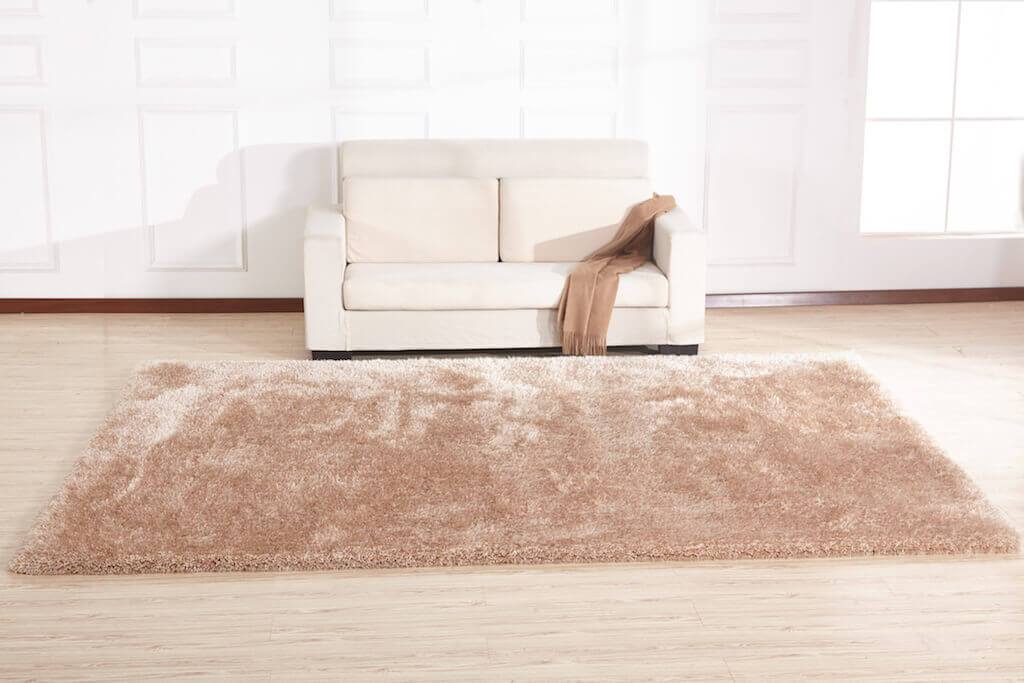 Chubby Beige Area Rug showcasing soft shaggy texture and solid color design, perfect for home decor.